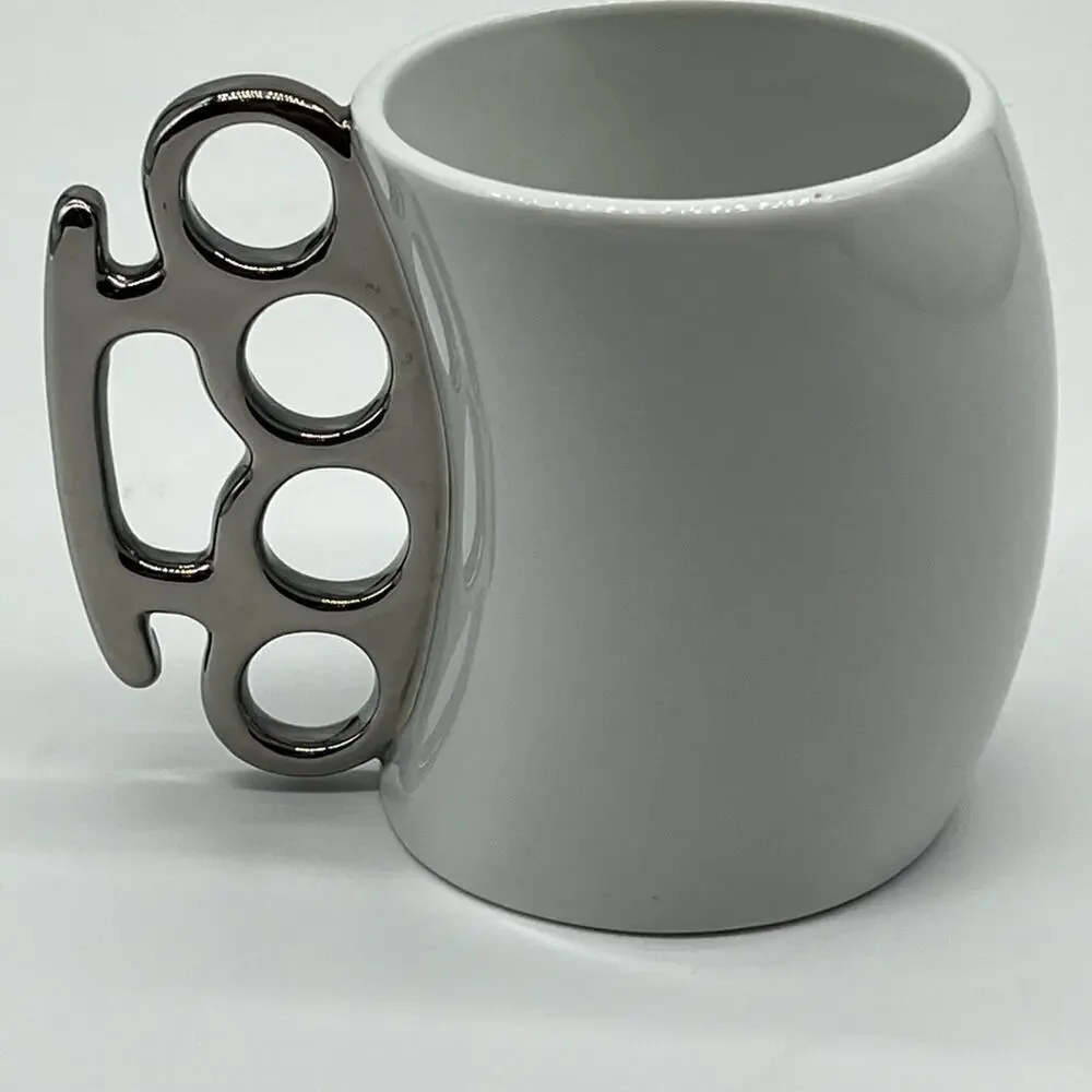 Brass knuckles coffee mug white and silver